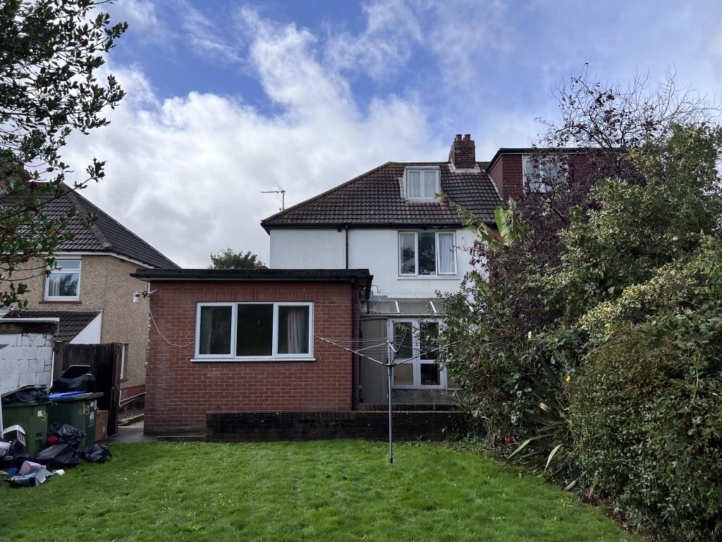 Lot: 75 - SEMI-DETACHED HOUSE WITH POTENTIAL - Rear of house looking from garden showing extension